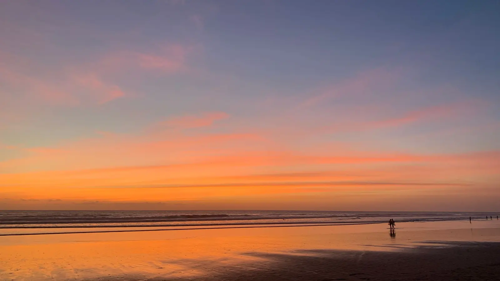Orange sunset over the beach on the west coast of Bali