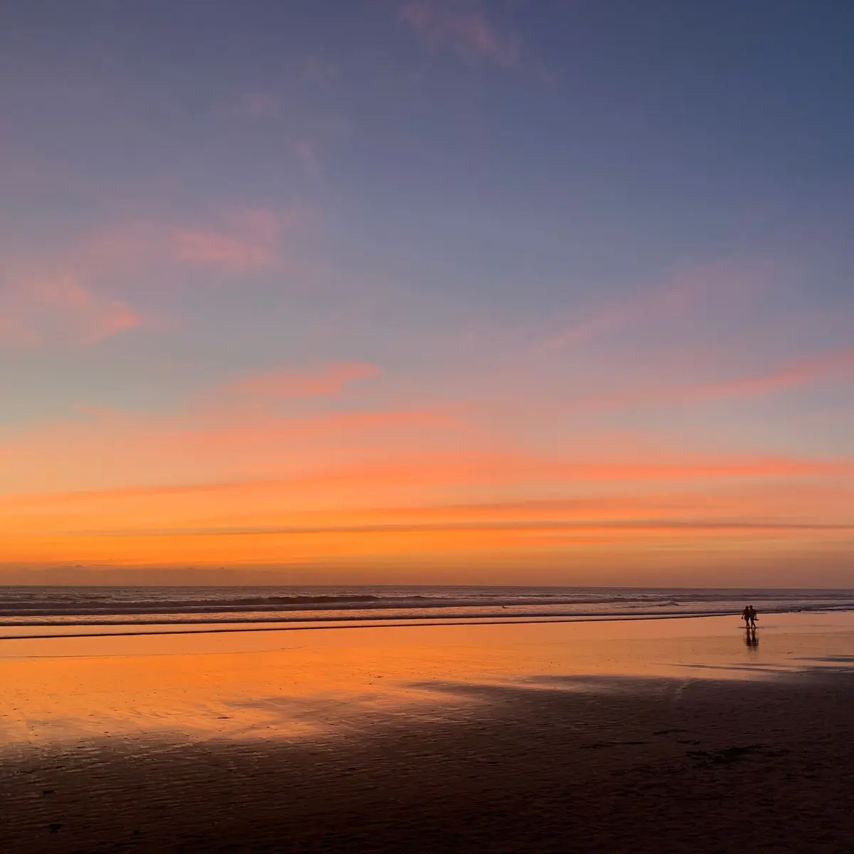 Orange sunset over the beach on the west coast of Bali